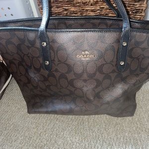 Black and brown leather coach tote.